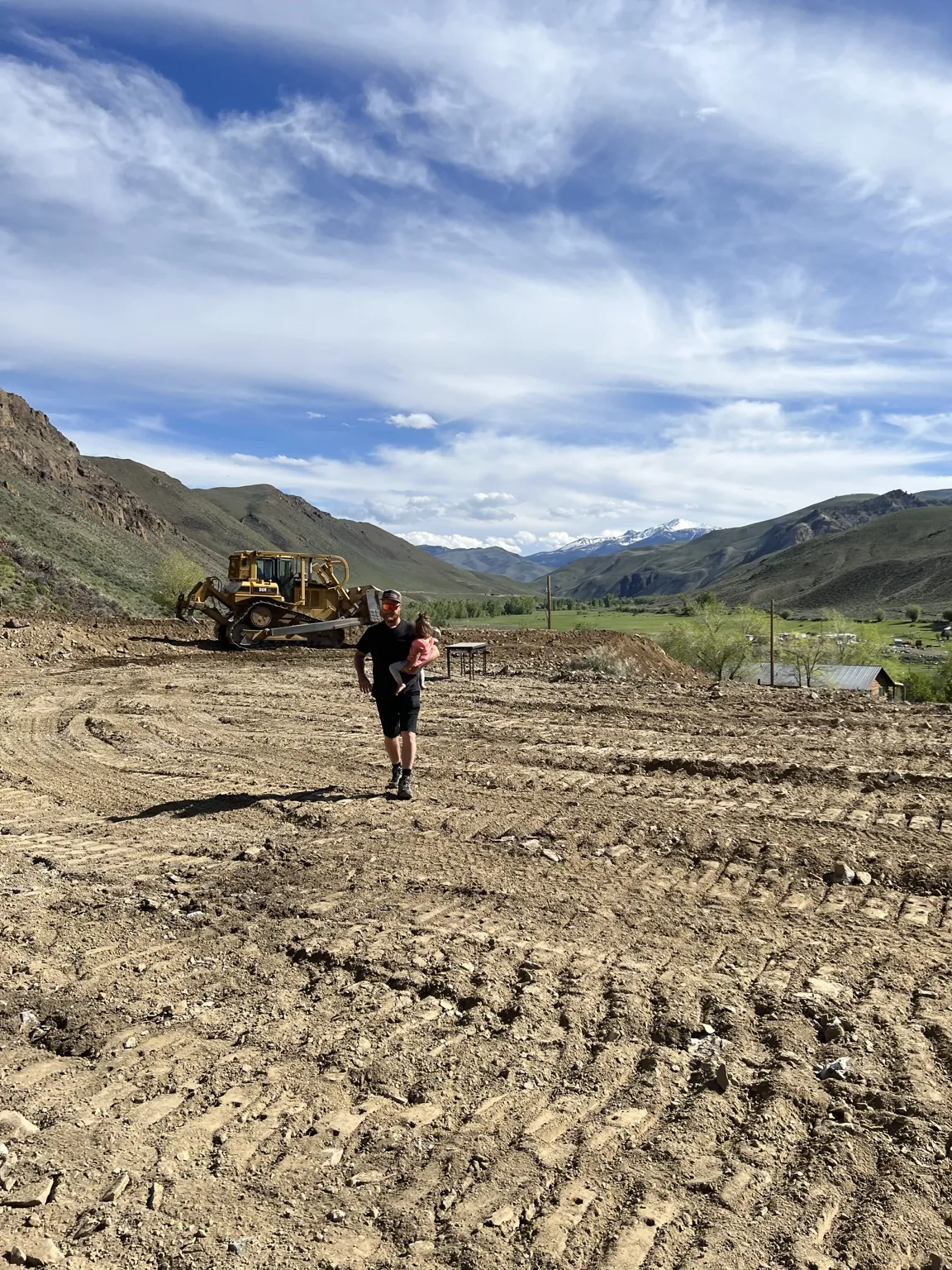 Peter and his daughter at the cleared Clayton, Idaho building pad