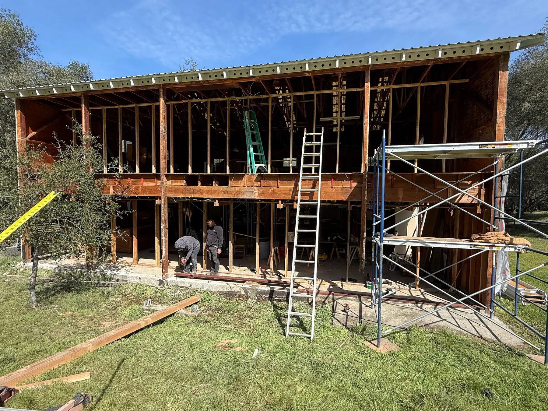 Crew working at the exposed two-story structure