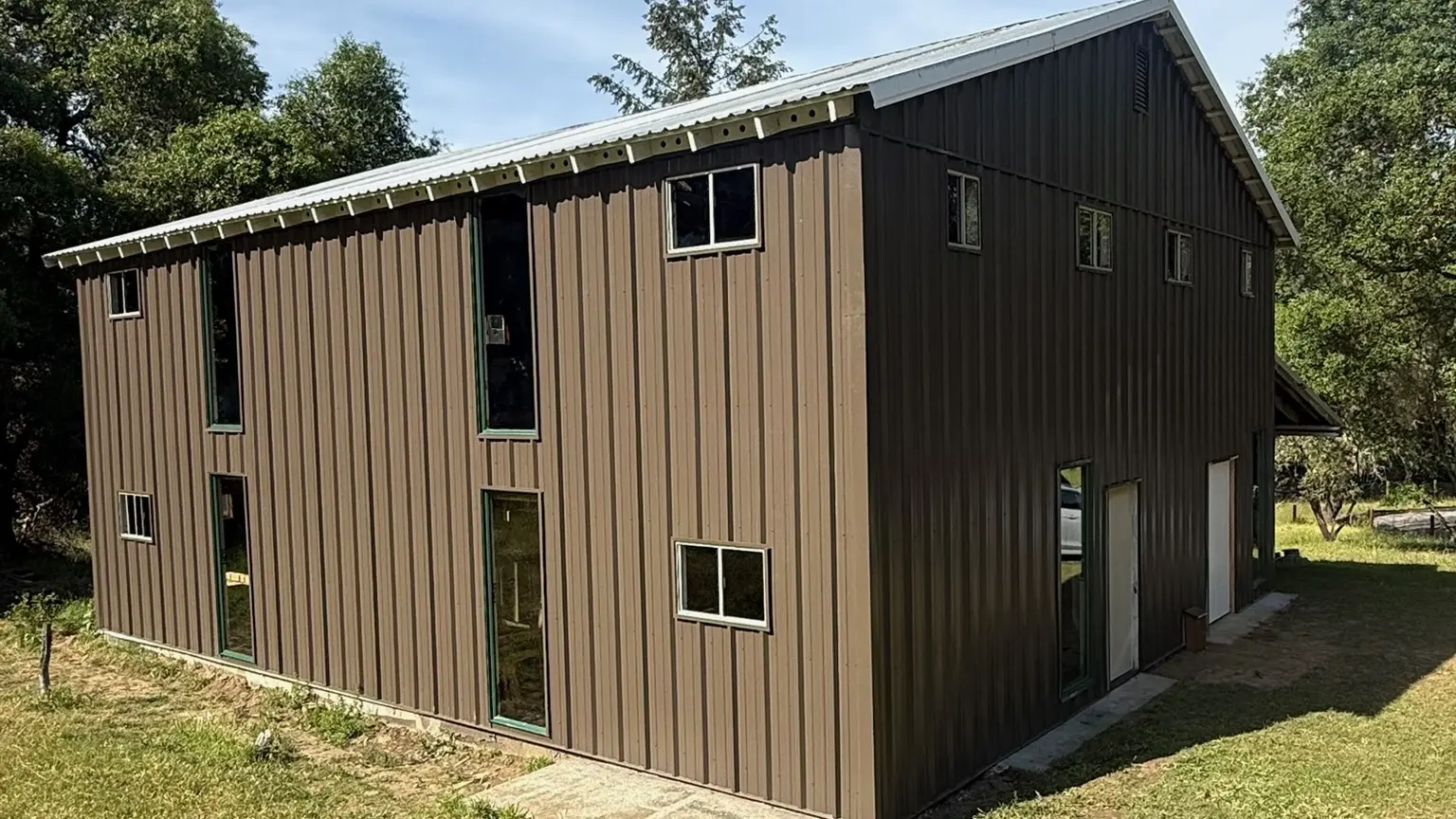 Completed two-story Anderson Valley building with new dark metal siding