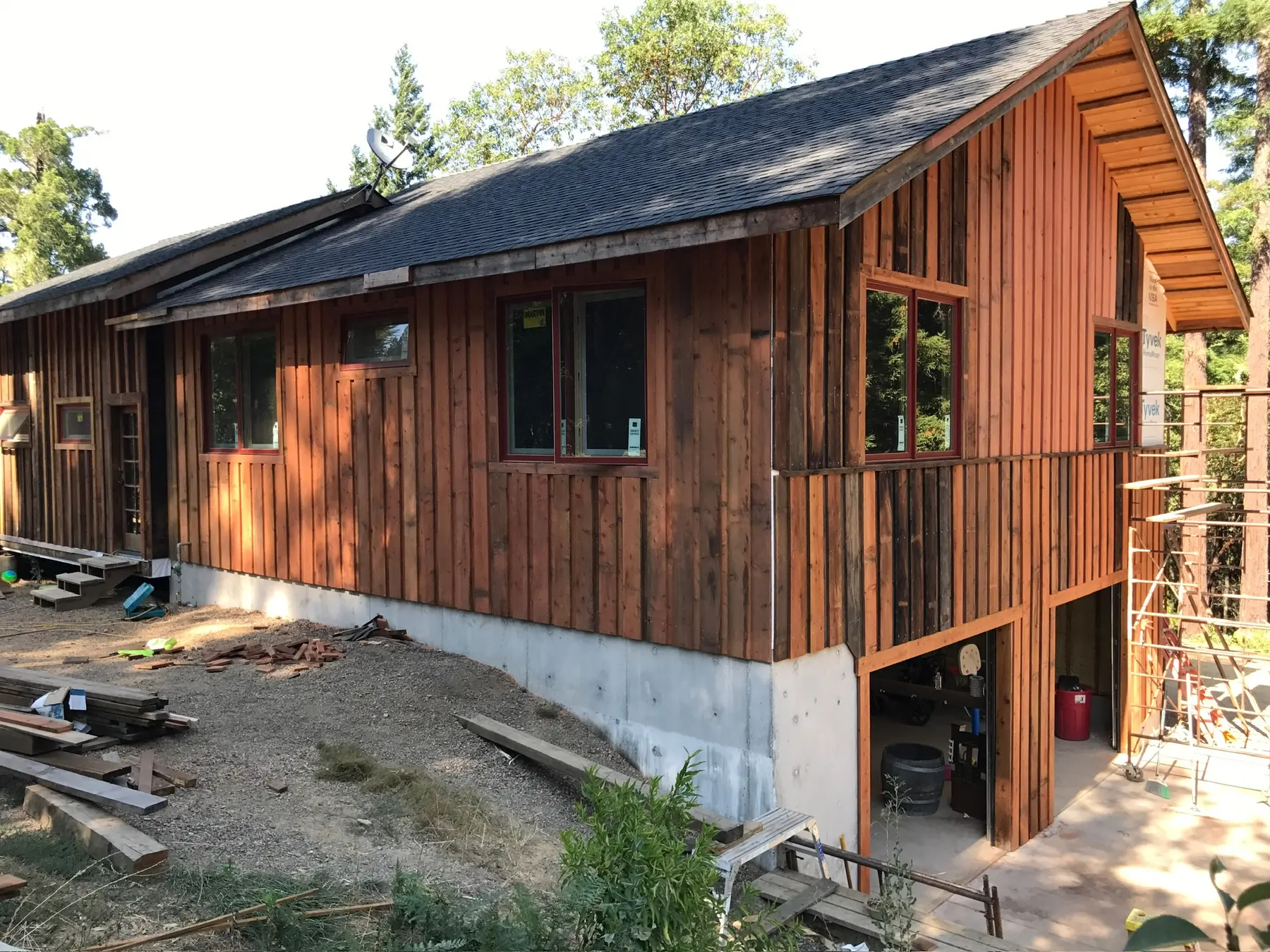 Redwood siding and windows underway on the Old Mill residence