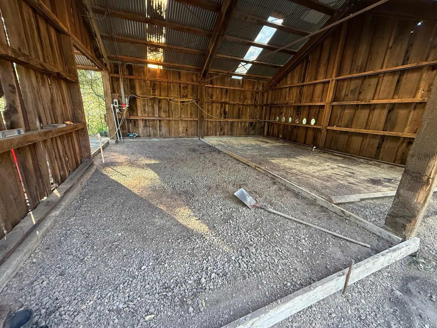 Cleared interior shell of the former horse barn