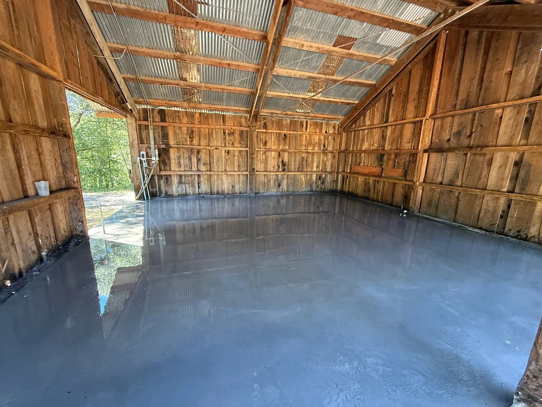Finished concrete slab inside the converted horse barn